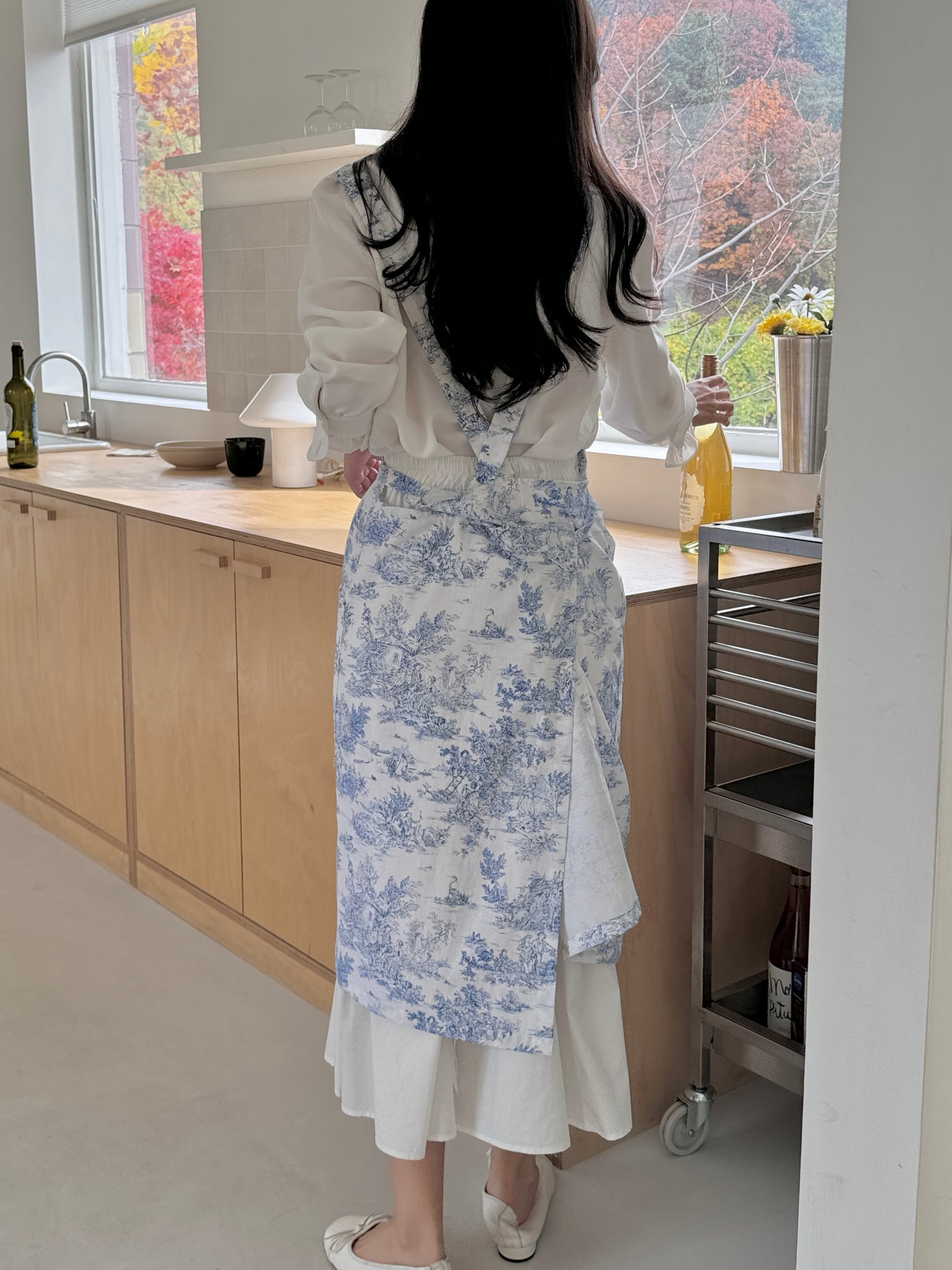 Blue Velouving Toile De Jouy Apron adding style and functionality to daily tasks.